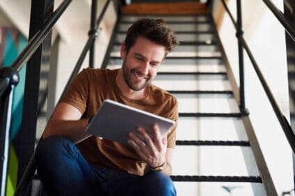 Man,,Office,And,Happy,With,Tablet,In,Staircase,For,Creative
